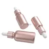 Botellas de almacenamiento 10 ml 15 ml 30 ml Botella cuentagotas de vidrio escarchado de oro rosa Aceite esencial vacío Envase de embalaje recargable cosmético 25 unids / lote