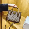 2023 Monederos Liquidación Outlet Venta en línea Nuevo Estampado de moda premium Pequeño cuadrado Versátil Un hombro Crossbody Casual Bolso de mujer