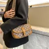 2023 Femme Luxury Designer Bolsa Crossbody Sacos para mulheres Comprador de couro Bolsas de aba pequenas