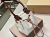 Womens retro bucket bag Luxurious canvas parquet leather square bag is very small and can be used with a sloping back canvas material fashionable and versatile