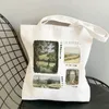 Shoppingväskor 2023 rolig mångsidig tecknad tryckt duk väska kvinnors axelmode handväska
