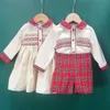 Sets kinderen kerstkleding jongens meisjes hmade smocking set en jurk broers en zussen rood plaid katoen met lange mouwen vakantie outfits