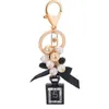 Key Rings New Creative Perfume Bottle Key Chains Fashion Beads Keychain Bowknot Key Ring Women Bag Charm Car Keyring Pendant Gifts G230210