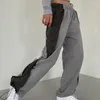 Pantaloni da donna Trend da donna Casual Lato irregolare Design a blocchi di colore Pantaloni della tuta Autunno e inverno Leggings caldi e spessi Donna
