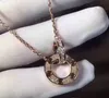 Мода круглый кулон ожерелье ювелирные изделия пара мужчин и женщин двойное кольцо полный cz два ряда бриллиантовый кулон восьмиугольный гайка любовь ожерелье пара подарок.