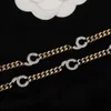 2023 Cinturón de cintura de calidad de lujo con diamante en dos colores Negro de oro negro Cadena larga tiene un sello de caja PS7554A9375554