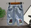 Completi Completo per bambini Ragazzo a maniche corte Abbigliamento Cuciture Lettera di moda Stampa Jeans strappati a maniche corte Twopiece Kids of Ye