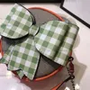 Designer Children Letter Printed Circular Handbags Kids Checkered Bow Messenger Påsar 2023 Luxury Big Girls Single Shoulder Princess Bag A9605VV