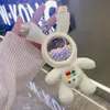 Nyckelringar söt plysch astronaut nyckelring utrymme för män kvinnliga anime biltillbehör skolväska charm vuxen barn gåva