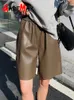 Pantalones cortos para mujeres de cuero negro coreano pantalones cortos para mujeres con bolsillos con cintura alta de pierna ancha larga pantalones cortos de mujer largos faux pule 230213