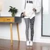 Leggings femme mode noir blanc impression femmes Sexy rayure serré élastique mince crayon pantalon Lolita cravate tendance recadrée