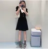 Casual Dresses Designer Black velvet V-neck dress 2023 early spring new bow bubble sleeve high waist A-line skirt EMCP