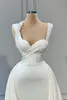 2023 Mermaid Wedding Jurken Afrikaanse lieverd Cap Mouwen Satijnparels Crystal Beading Vestidos Formele bruidsjurken Plus size overskirts Afneembare trein