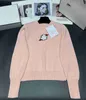 Projektantka Sweter 22SS Kobiet Kobiet Crewneck Stripes Fashion Długie rękawy Wysokiej klasy Jacquard Kurtka Z3R5GA