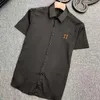 Tallas grandes para hombre Camisetas de diseño Camisas de diseño Letra del pecho Solapa Manga corta Cárdigan Botón de color sólido de alta calidad Shi276n