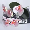 Dekorative Blumen-Orchidee mit Blättern, künstliche Blume, weiße Schmetterlings-Orchideen, gefälscht für Zuhause, Hochzeitsdekoration