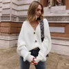 Malhas femininas tees botão casual malha v suéter de cor sólida top 2023 moda outono de mangas longas cardigan solto