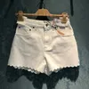 Shorts pour femmes Designer 2022 printemps et été nouvelle vague de dentelle brodée short en denim blanc polyvalent pantalons chauds femmes tendance MHY0