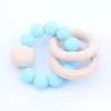 SOOTHERS TETESERS BABY TEELRINGS FOOD GRADE BEECH WOOD TEING RING RING RING TOYS SHOWER PLAY ROUND WOODS WOODS BEAD新生児SILE 826 DHMXE