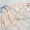 Pijamas femininas de seda feminina de seda feminina de duas peças de tração de tração de tira de lda de renda sólida Cardigã de manga curta