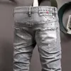 Heren jeans mode trendy merk persoonlijkheid gewassen licht grijs gespikkelde inkt slijpende witte jeugdbroek slanke midden-tailles mannen