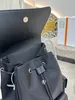 Unisex designer ryggsäck med dragsko dam axelväska stor kapacitet lyx skolväska herr mode triangel stor resväska