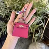 Designers keychains pendant cute mini bag small pendant leather headset organizer bag pendant female creative car keychain