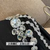 Tweedelige jurk Diamond ketting Onregelmatige jas Ol Draai kraag blazer vacht kristalbanen kralenpakket rok vrouw pak 2 stks set 230216