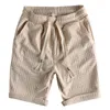 Mäns shorts 2023 Summer Waffle Texture Solid Color Casual Men's Loose and Bekväm Stickad Youth Capris Midpants Fashion 928