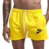 Mäns shorts solid sport avslappnad fitness andningsgymniga gym jogging träning träning lös man strandbyxor byxor