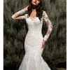 2023 Suknie ślubne syreny z długimi rękawami koronkowe aplikacje tiulowe suknie ślubne Wyglądaj przez guziki