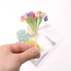 装飾的な花の花輪1bunch8pcsミニペーパーローズフェイクフラワーブーケウェディングデコレーション人工花ディースクラップブッキングガーランドリースフラワーT230217