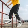 Męskie dżinsy 2023 Hip Hop Joggers Spodnie Cargo Mężczyźni Harem Multi-Pocket Ribbons Man Sweatpants Streetwear Casual Mens S-5xl298v