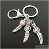 Porte-clés Longes Euroamerican Paw Print Pearl Cage Porte-clés Peut Ouvrir Creux Noctilucent Pierre Volcanique Pendentif Keyring Drop Delive D3O