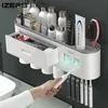 Toothbrush Holders IZEFS Magnetic Adsorption Inverted Holder Double Automatic Toothpaste Dispenser Storage Rack Bathroom Accessories Set 230221