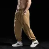 Men's Pants 2023 Muscle Sports Trousers Leisure Ftness Running Breathable Loose Elastic Country 230221