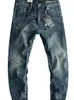 Jeans da uomo primavera blu baffi effetto lavato pantaloni dritti sottili elastici di vecchia moda pantaloni semplici da giovane a matita da uomo