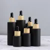 Förvaringsflaskor 20 ml-100 ml tomt glas dropparflaska matt svart kosmetik hudvård återfyllbar eterisk olja med bambu lock