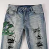 6561 Jeans Pantalones de diseñador Hombre Denim Chao Marca Distressed Amirres Serpiente Verde Bordado Agujero Parche Slim Moda Slim Pies Pequeños Blue Jeans Hombre IIGX