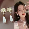 Light luxury Charm high sense drop oil camellia earrings ins vintage design sense pearl earrings fashion OL popular earrings