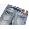 Męskie dżinsy chude mężczyźni 2023 Autumn Fashion Stretch Raped Flame Print Retro Blue Slim Pencil Pants Streetwear