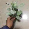Dekorativa blommor 7st flockar effekt grönska växt konstgjord latifolium turcz blad gäng för bröllop xmas hem blommig dekoration