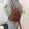 Bolsas escolares mini mochila de pelúcia de cor sólida mulheres meninas selvagens moda de outono de outono de inverno de inverno pequeno mochila pequena para a rua de compras