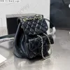 CC Sac à dos Style Mini brillant huile cire vachette collège sac à dos sacs de créateurs classique noir blanc diamant matelassé métal matériel rabat cartables femmes extérieur luxe