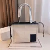 Embrague de diseñador de lujo Bolso totes de hombro Moda simplicidad Compras mujeres equipaje Bolsa de lona Hombres de cuero genuino Bolsos de playa simplicidad Cross body bolsos grandes