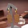 Absolutely the latest explosion charm earrings. Gold plated grid in brass. Brand, fashion, classic luxury earrings designer for women. wedding party bridal jewelry