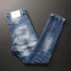 Męskie dżinsy europejskie amerykańskie mody mody retro niebieskie elastyczne szczupły rozryte malowane designerskie hip hop dżinsowe pieprzenia Naom22