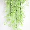 装飾的な花5ヘッド人工植物ラタントロピカルジャングルツリーブドウの偽の壁ぶら下がっている家庭用プラスチック製の花