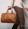 Duffel Bags Vintage High -End Brown Black Genuine Short Trip Business Men Women Travel ombro 22 Duffle Gym M1028