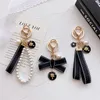 Designer Fashion Keyring Keychains Brands Luxury Brands Pearl Famate Keyrs Women Lovers Couple Borse Coperie Cate Chiave Catene Cancella